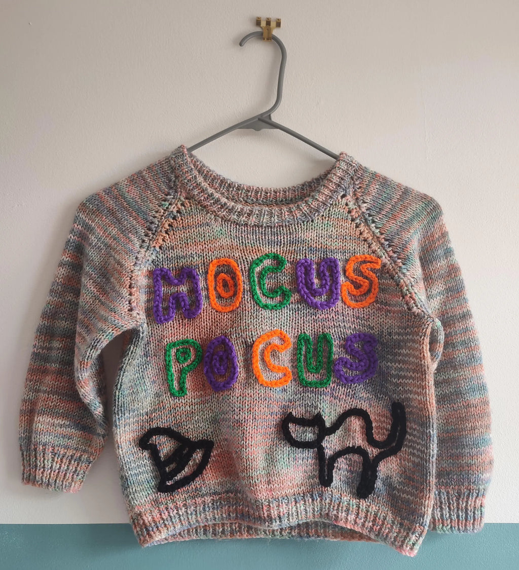 Hand embroidered hocus pocus Halloween jumper. Handmade knit with rainbow wool. Size 3-4 years