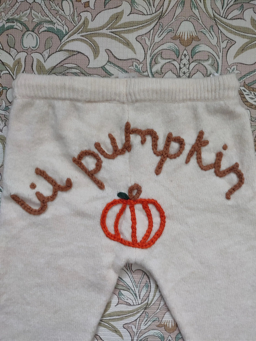 Hand embroidered cream neutral lil pumpkin knitted trousers. Halloween, autumn knit. Size 9-12 months