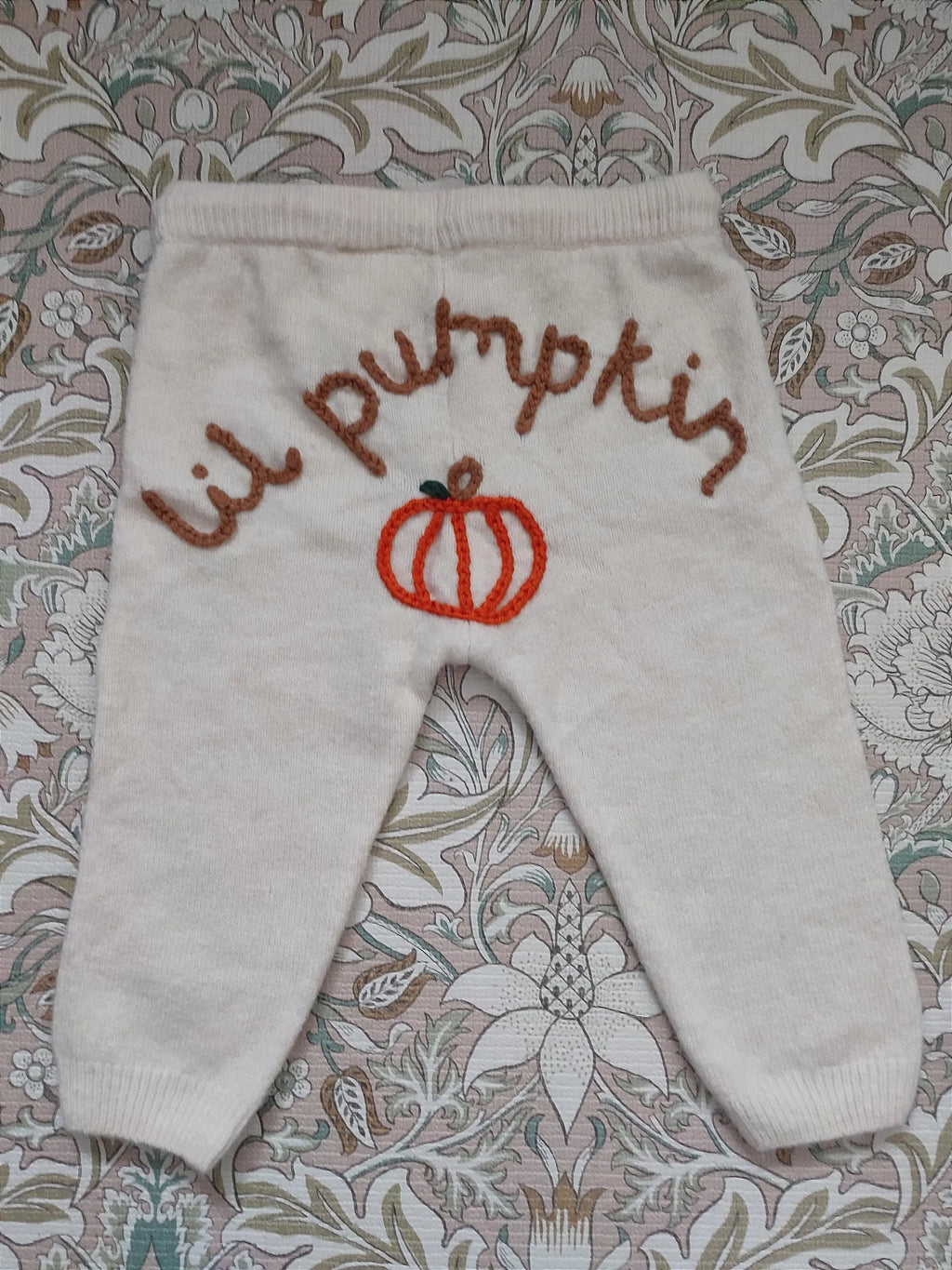 Hand embroidered cream neutral lil pumpkin knitted trousers. Halloween, autumn knit. Size 9-12 months