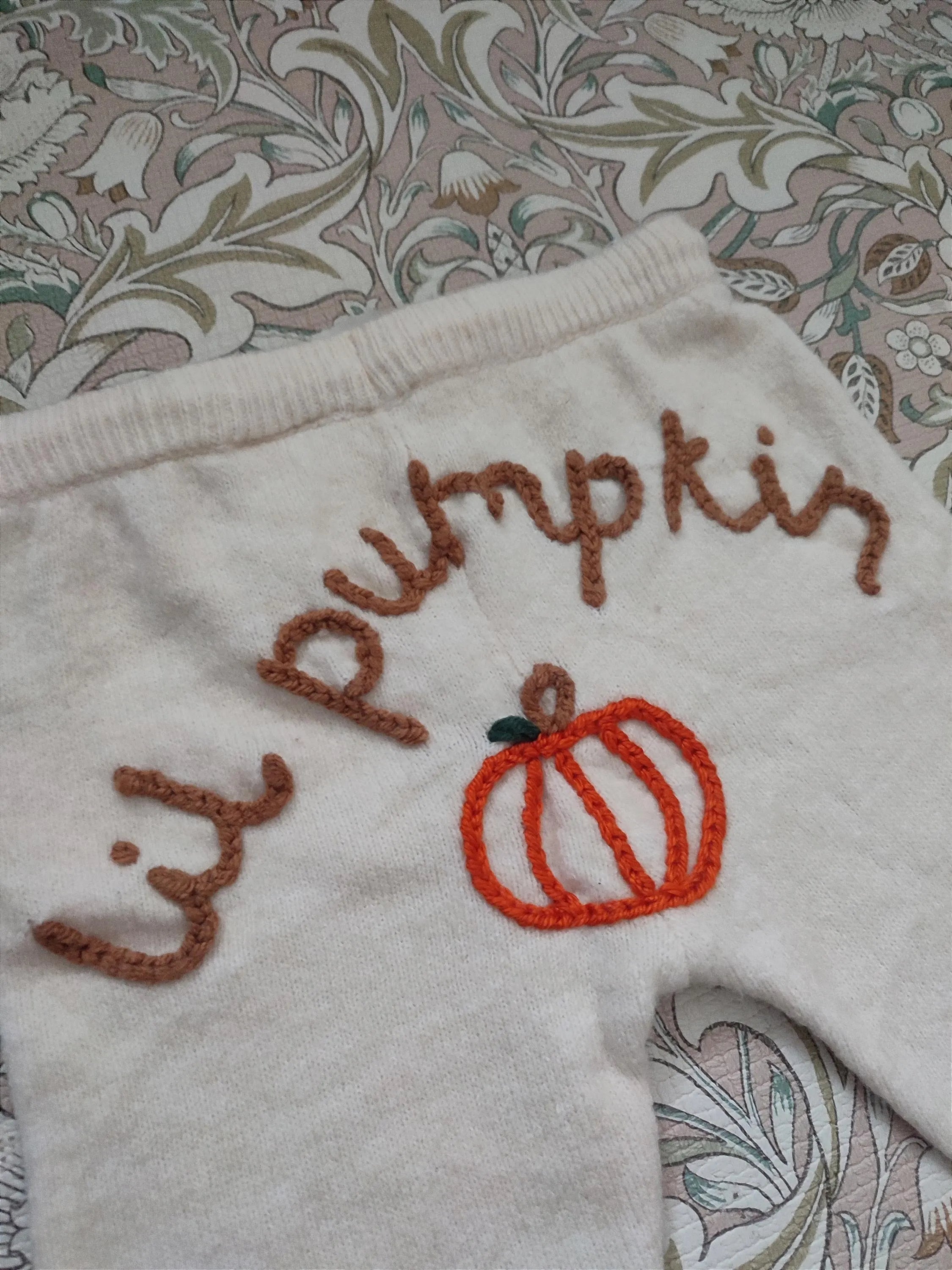 Hand embroidered cream neutral lil pumpkin knitted trousers. Halloween, autumn knit. Size 9-12 months